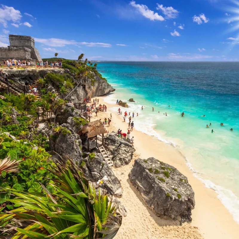 the beach below the maya ruins in tulum 