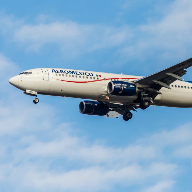 Aeromexico plane flying high in the sky 
