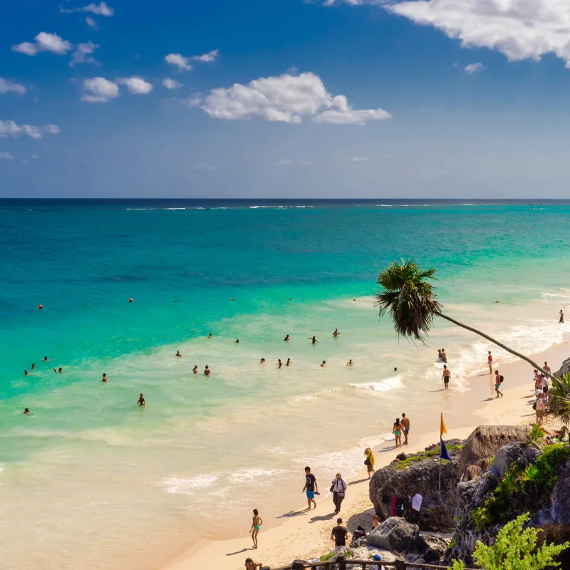 tulum beach with lots of tourists