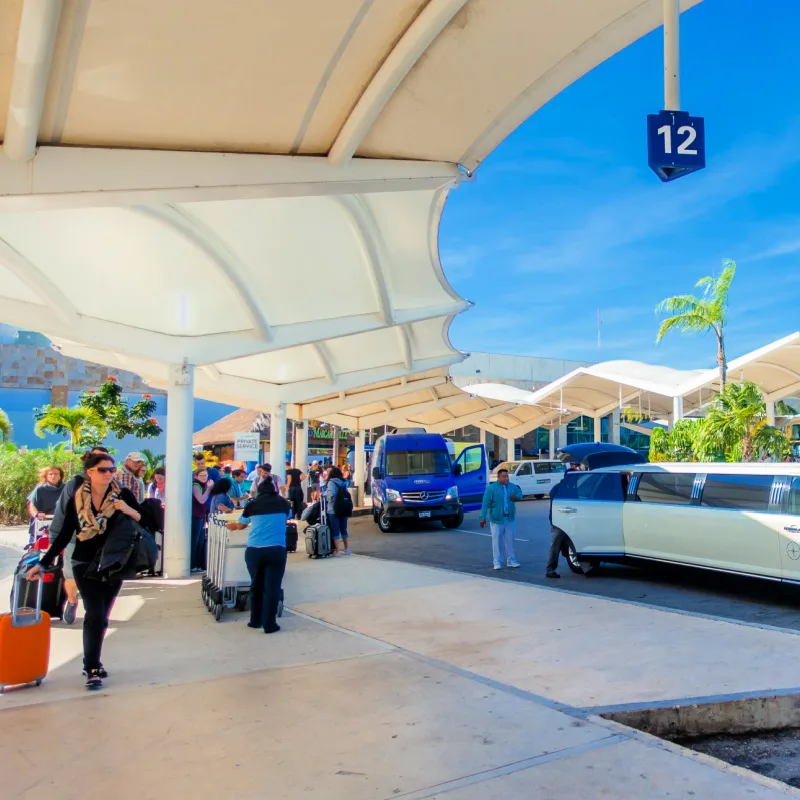 CANCUN, MEXICO - Unidentified people walking at the enter of Cancun International Airport, Mexico