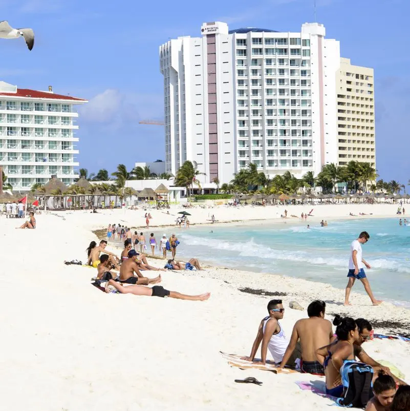 Tourists relaxing on the beach