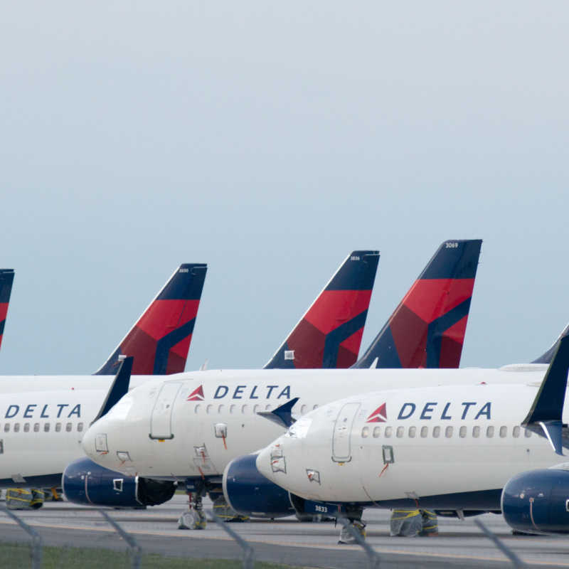 delta aircraft on the tarmac in an airport 