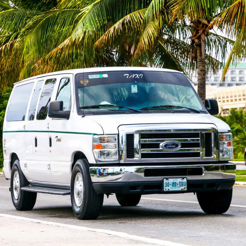 a large taxi on the road in cancun 