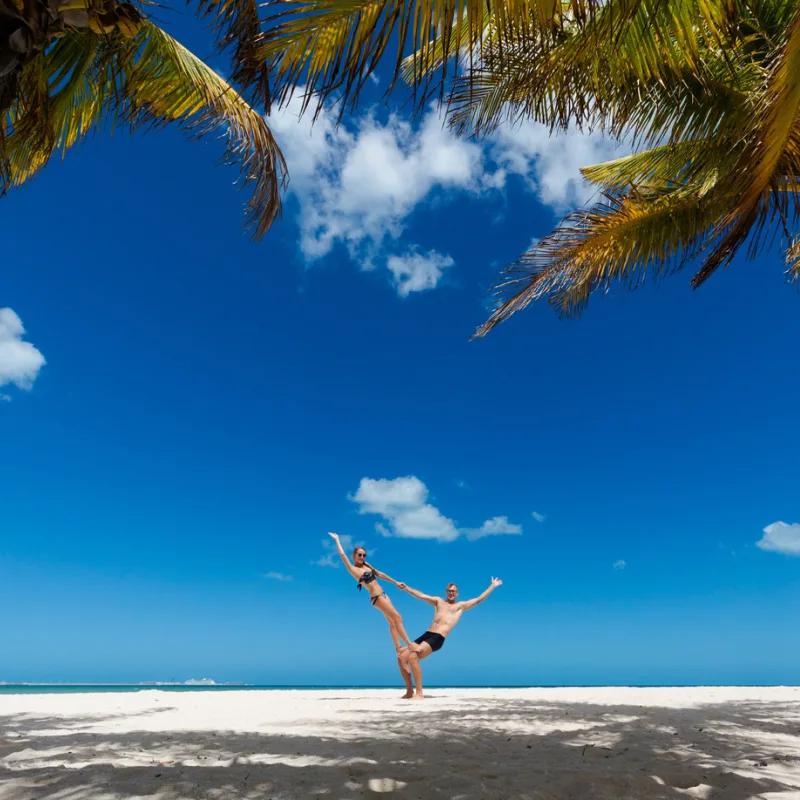 happy couple on a beach in the mexican caribbean