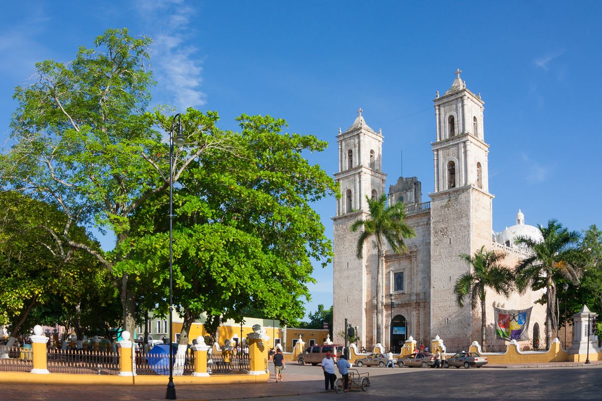 Valladolid, Yucatan, park with trees and the town's parish in the background