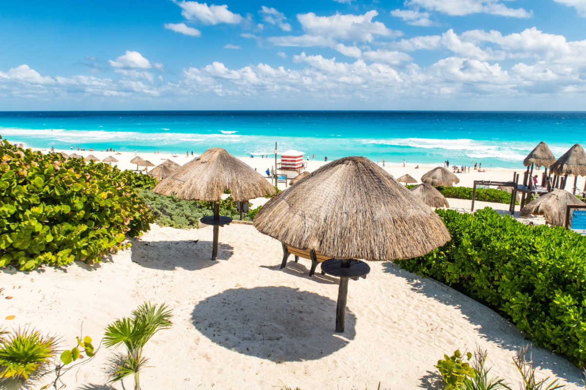 A white sand beach in cancun with shade