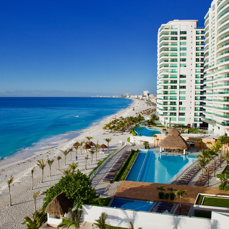 Cancun Hotel Zone with a calm sea and resorts on a sunny morning