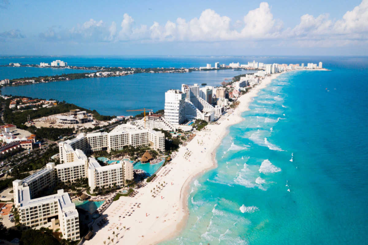 Aerial view of a long white sand beach in cancun 