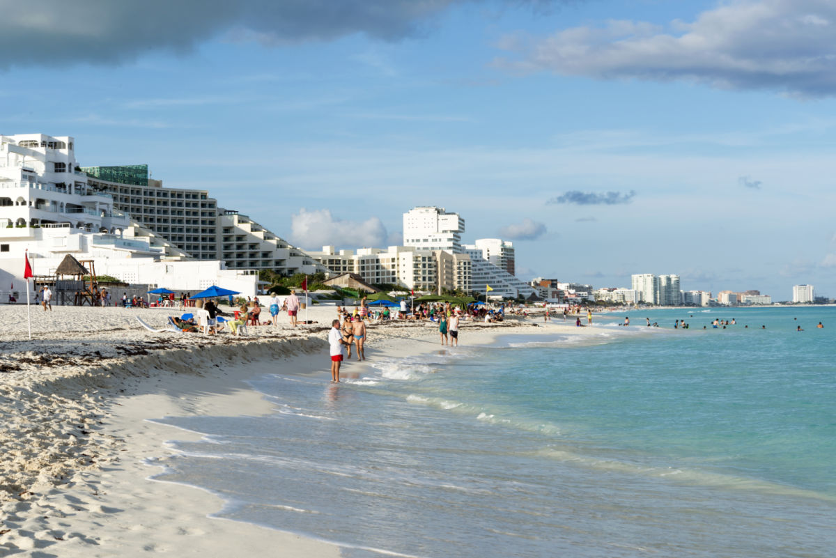 Tourists on a Beach in front of Hotels in the Cancun Hotel Zone