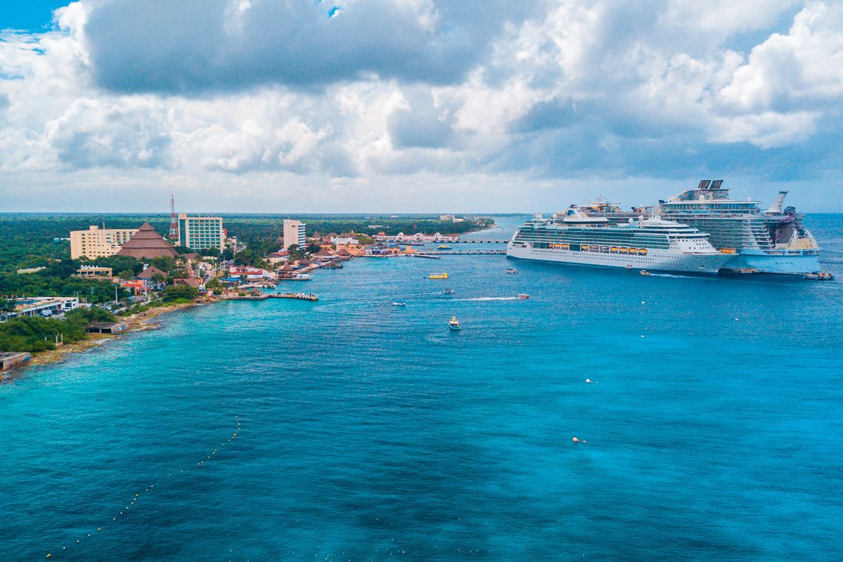 Cozumel view with turquoise waters, boats, and cruise ships