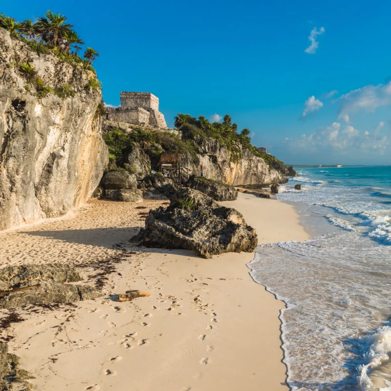 tulum beach with Mayan ruins above