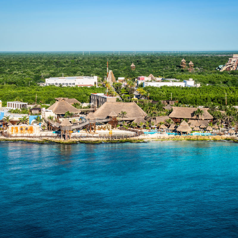 aerial view of a white sand beach and attractiosn in the costa maya