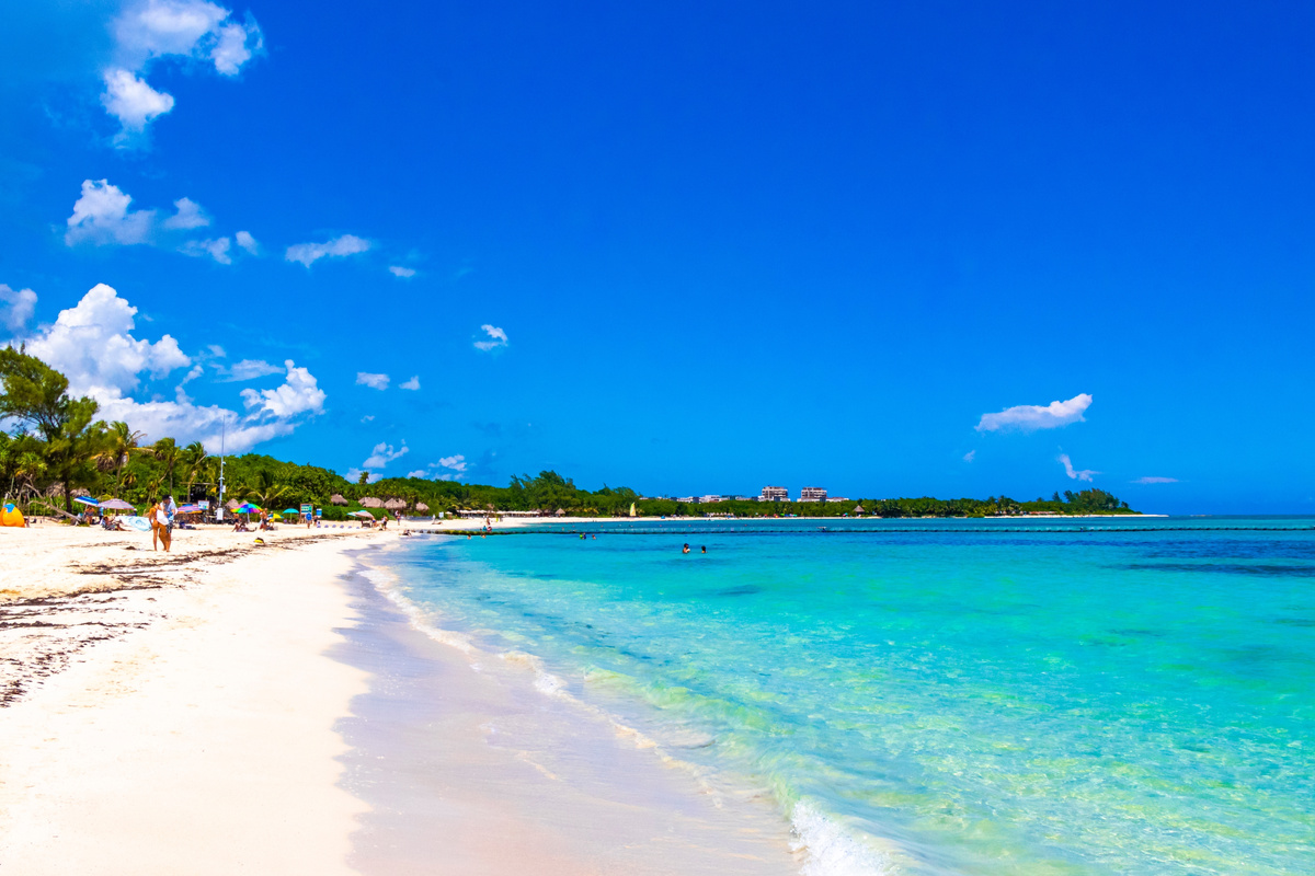 crystal clear blue water and sugary white sandy beach in playa del carmen