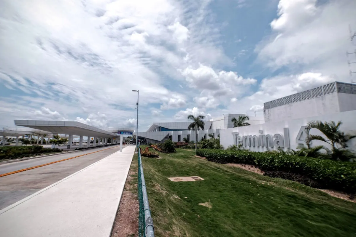 a busy scene in front of cancun airport
