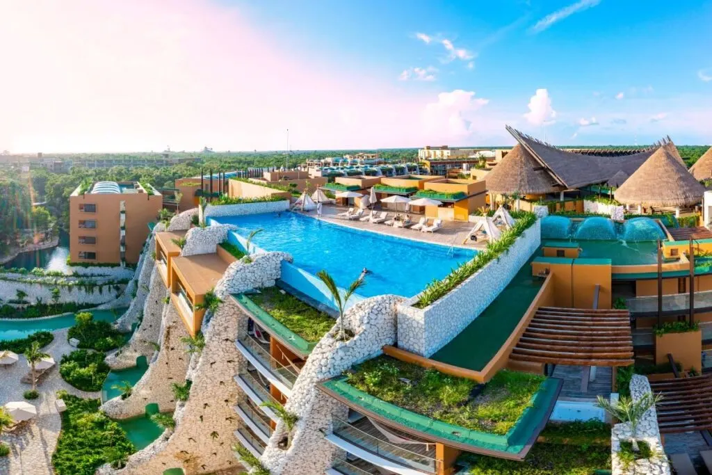 Aerial tour over a luxurious 5-star hotel resort next to the beautiful beaches of Cancun with sunny weather