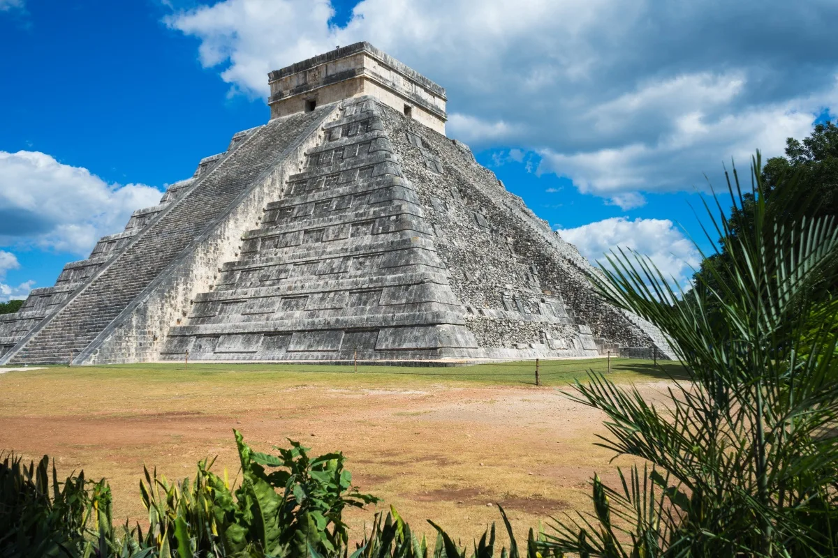 El Castillo Temple Chichen Itza with agave plants