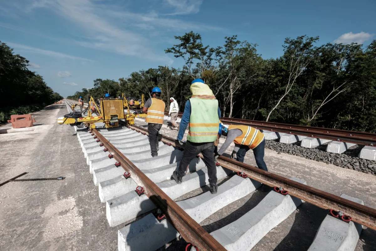 Engineers Working on the Maya Train