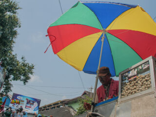 street vendor in Mexico with colorful umbrella