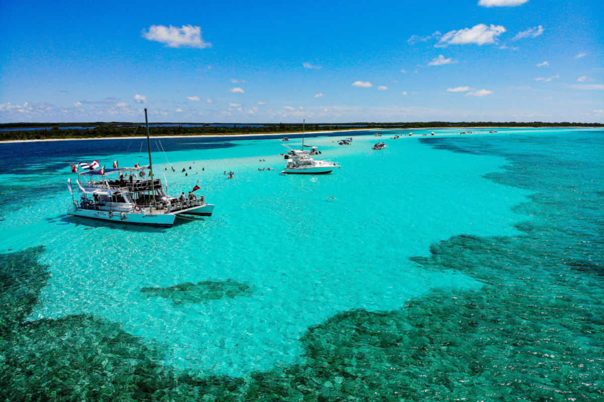 Stunning azure water in cozumel with boat
