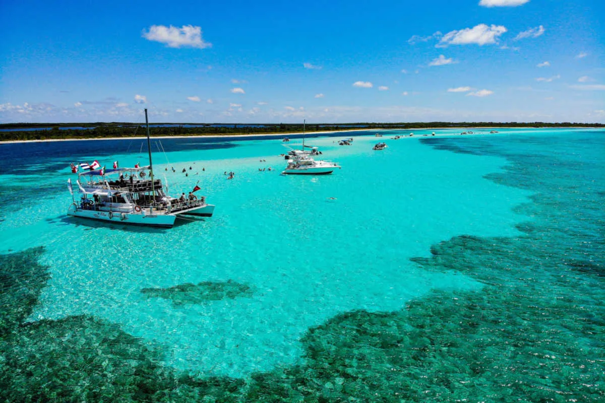 Stunning azure water in cozumel with boat