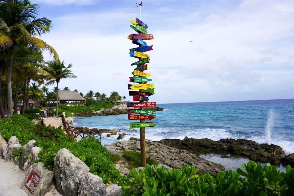 Multi-directional sign with wooden arrows at Xcaret Park