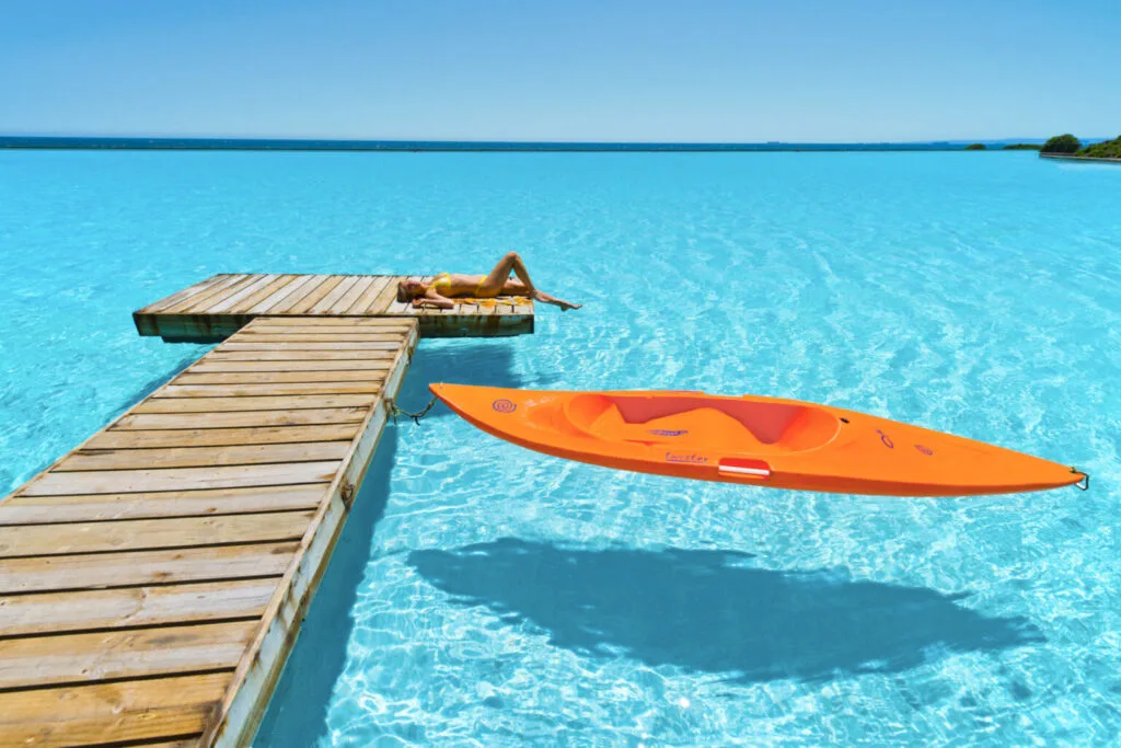 guest sunbathing on deck at AVA Cancun