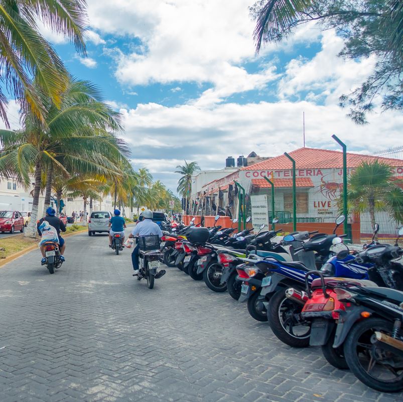 motorcycles parked on a street in mexico