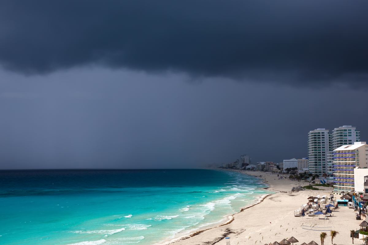A shot of the Cancun shoreline with dark cloudcover 