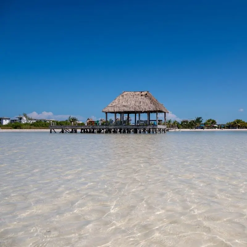 Wooden hut in the water on the beach of the paradisiacal island of Holbox in Mexico