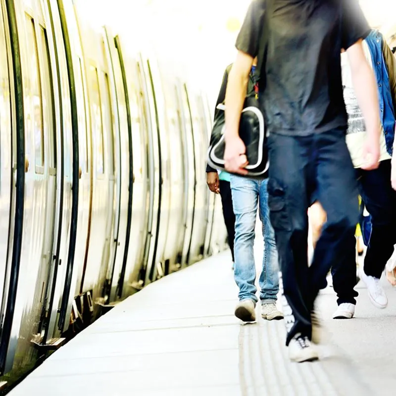 Passengers Walking Through a Train Station
