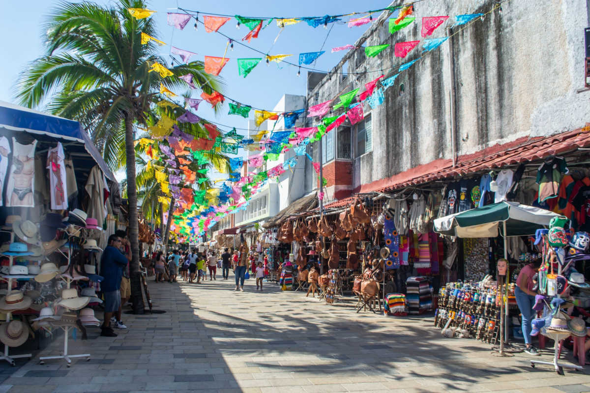 downtown view in playa del carmen with travelers