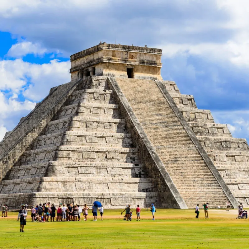 Tourists Standing Around a Pyramid at the Chichen Itza Mayan Ruins