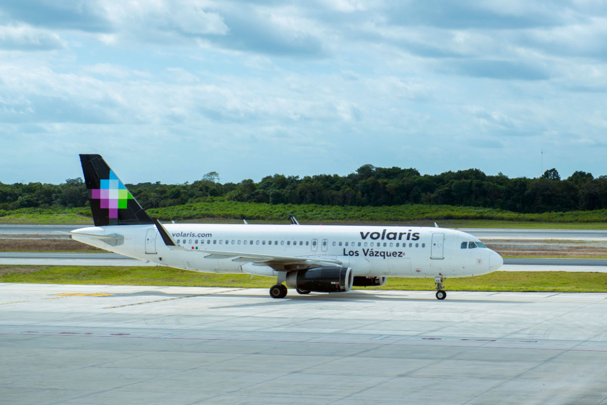 a volaris airbus aircraft in cancun international airport 