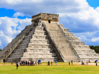 Tourists Standing Around a Pyramid at the Chichen Itza Mayan Ruins