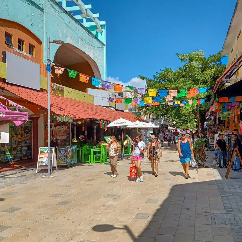 busy street with tourists in Playa Del Carmen