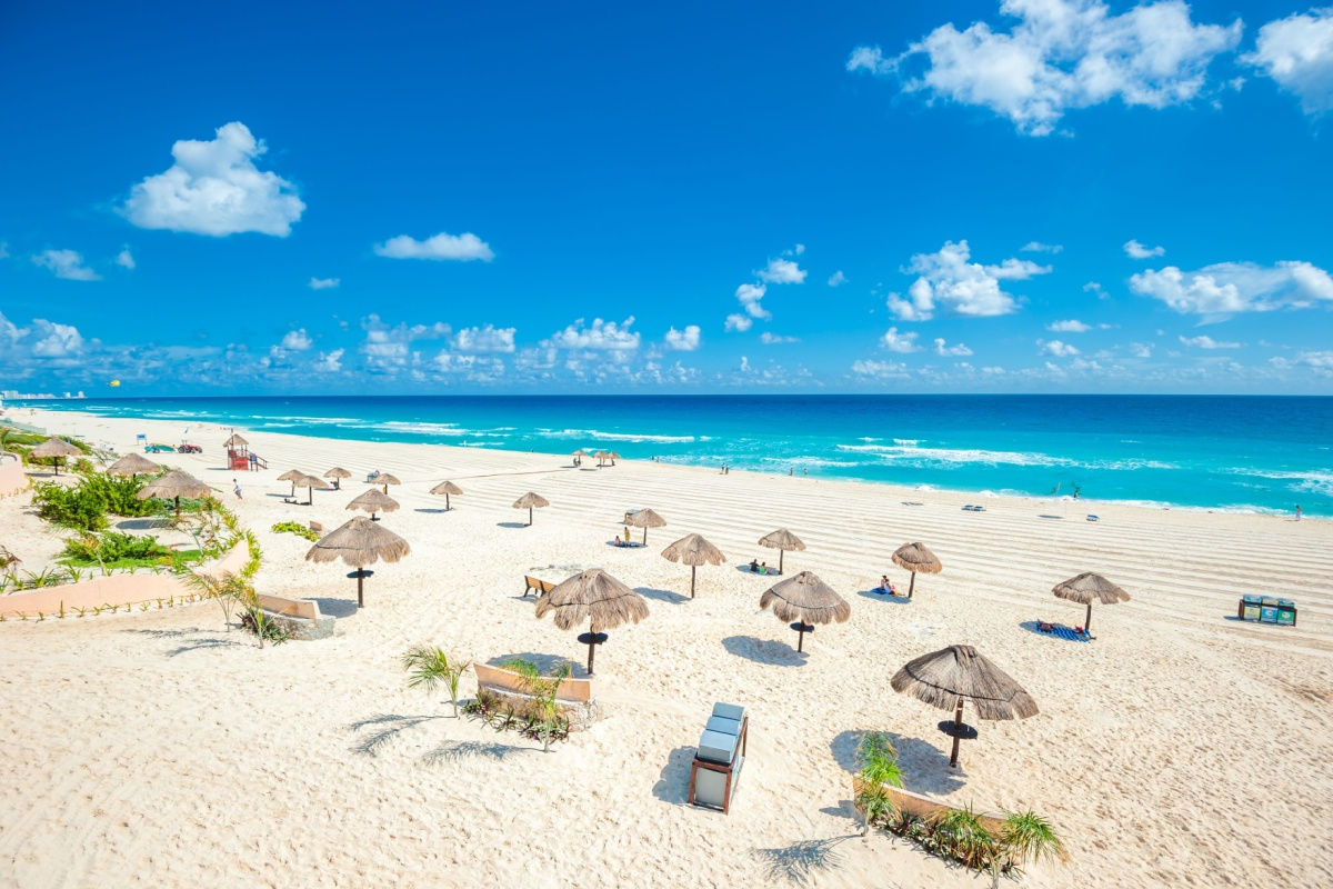 a white sand beach in cancun with crystal clear water