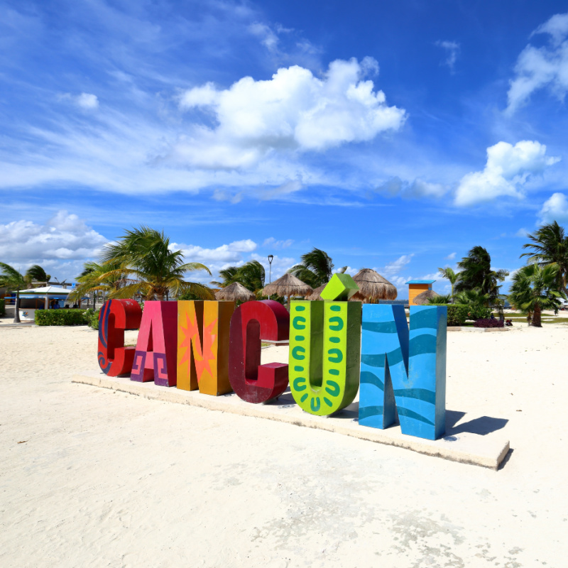Colorful Cancun Sign in the Sand on a Beach