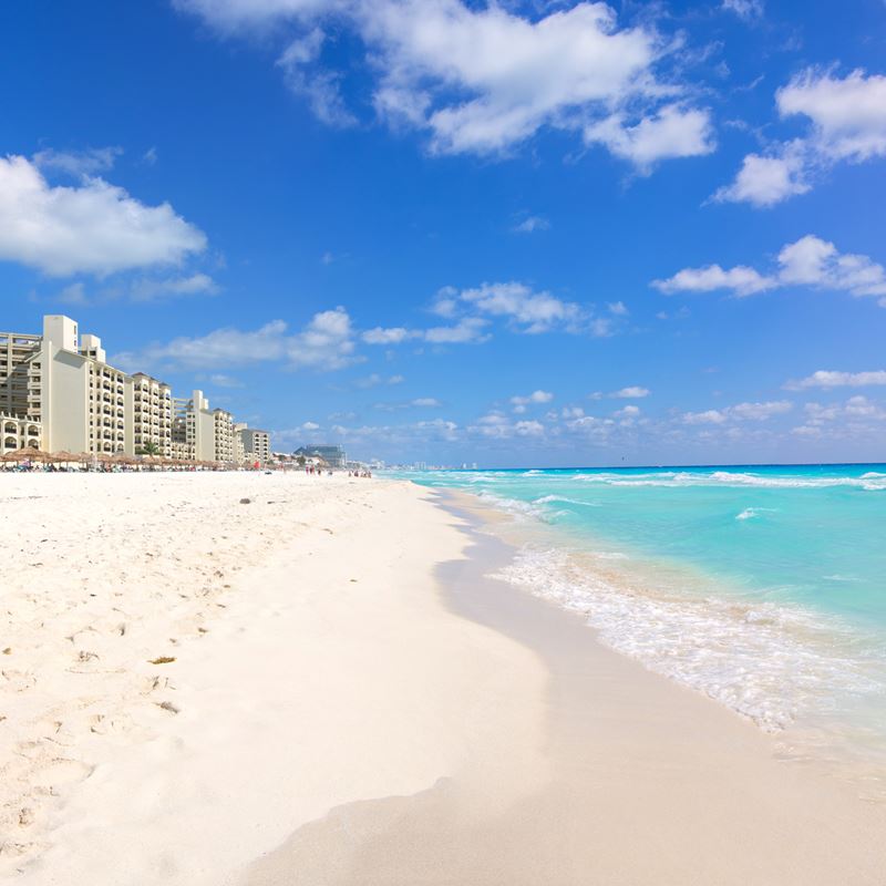 Cancun hotel zone beach on a sunny, tranquil day with clear skies