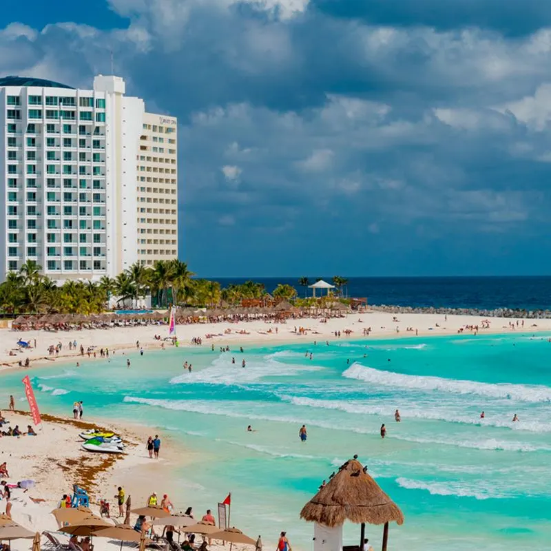 Cancun tourists enjoying a beach day in Hotel Zone