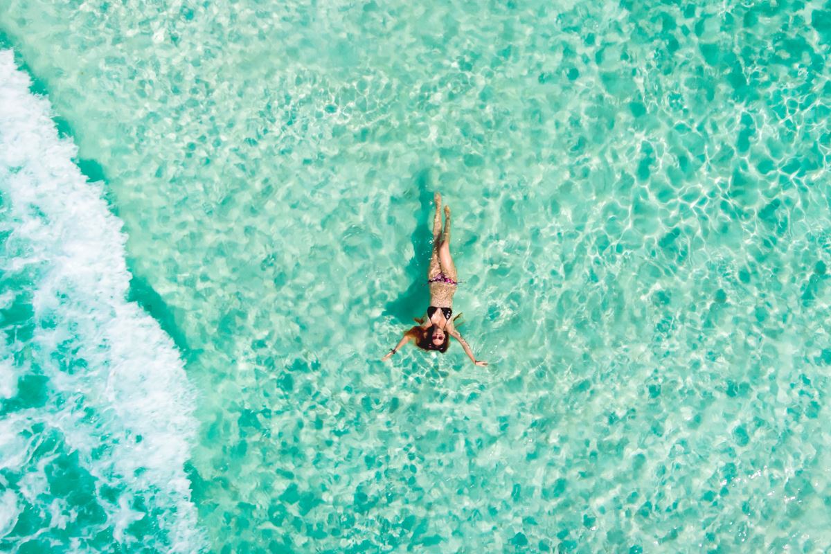 A woman floating in the Mexican Caribbean sea