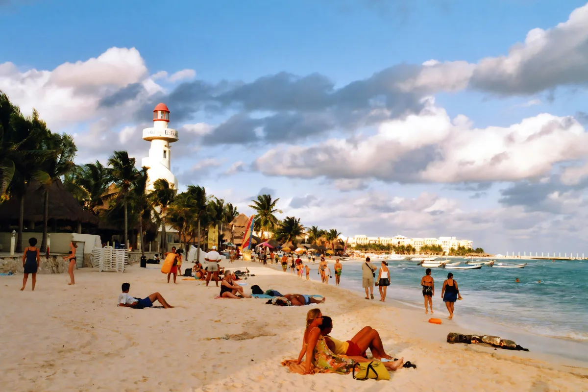 tourists enjoying sunset on popular Playa Del Carmen beach