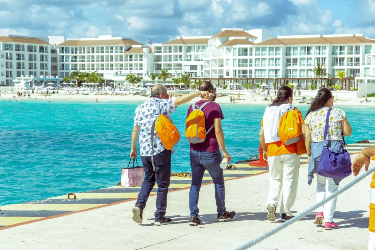 travelers walking on a playa del carmen beachfont area