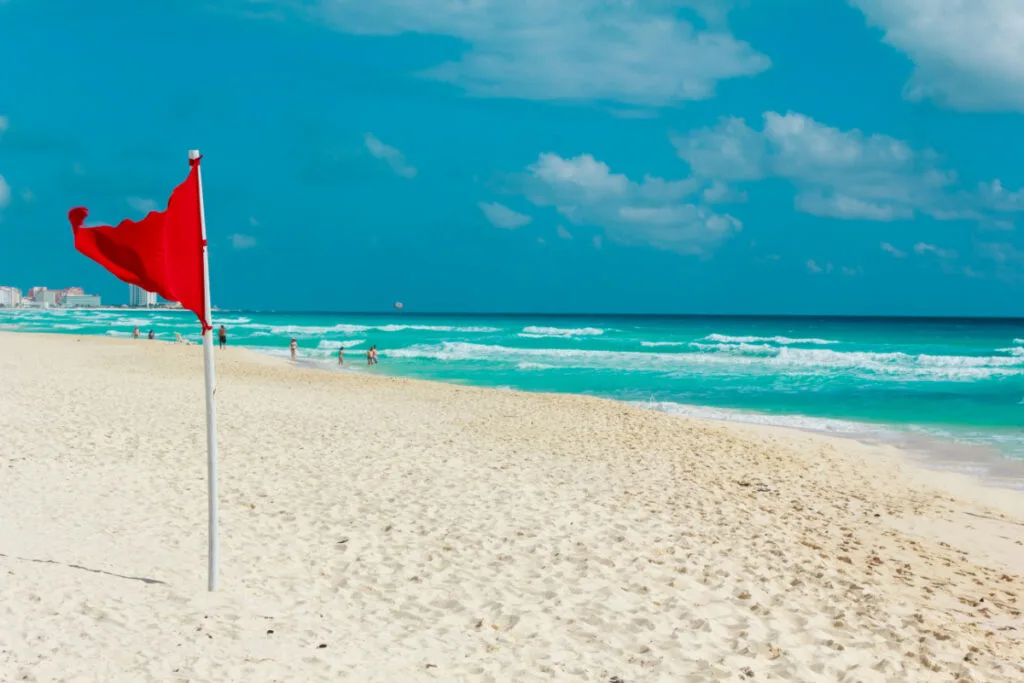 Red Flag on a Beach in Cancun, Mexico
