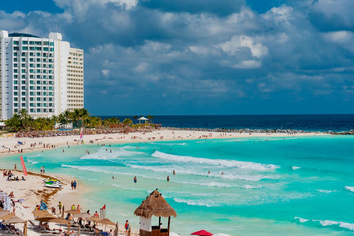 Cancun tourists enjoying a beach day in Hotel Zone
