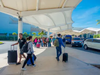 Tourists Waiting to Be Picked Up at Cancun Airport
