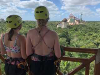 Two tourists wait for the zip line at Xplor by Xcaret.