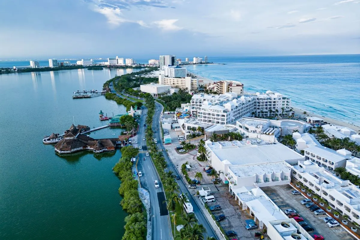 Take in the stunning daytime view of hotels and residences lining Nichupté Lagoon. The tranquil waters mirror the architecture, creating beautiful reflections that capture the essence of Cancún