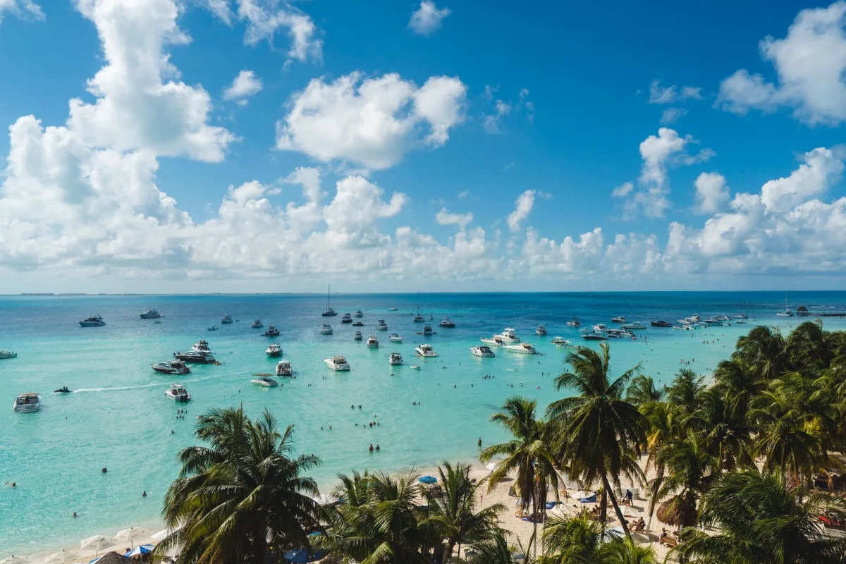 aerial view of white sand beach in Tulum with blue water