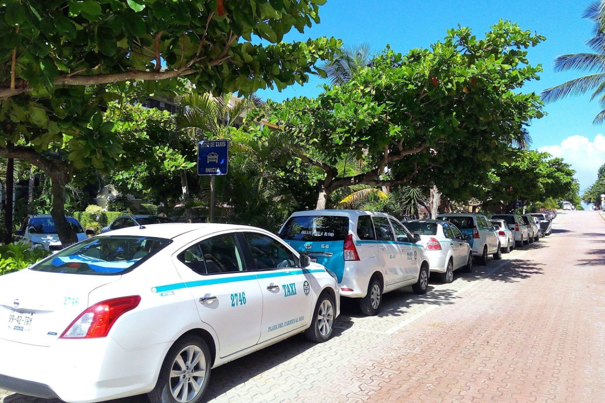 a row of taxis parked in Cancun 