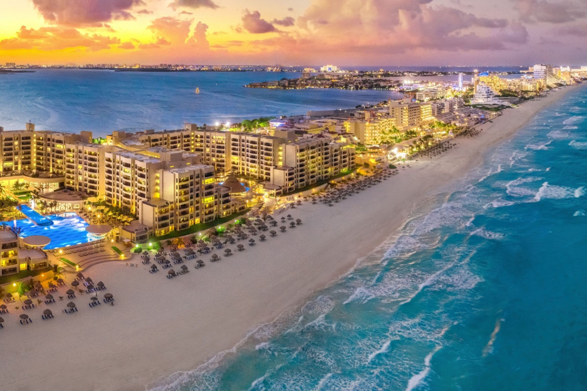 aerial view of cancun at night with resorts